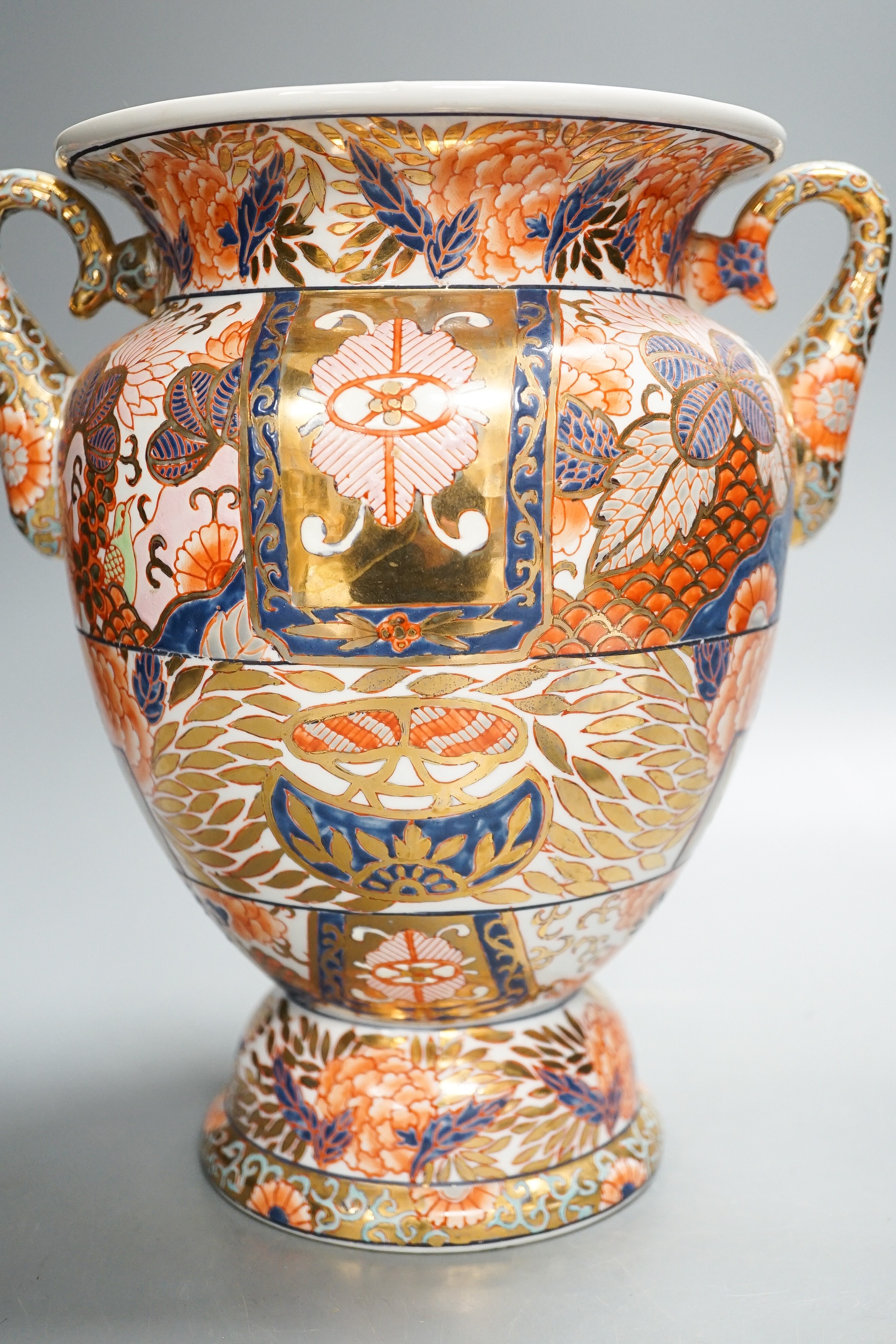 A twin handled Imari palette vase, a Japanese eggshell porcelain footed bowl, together with an 18th century Chinese porcelain bowl and saucer (with damage) 25cm (4)